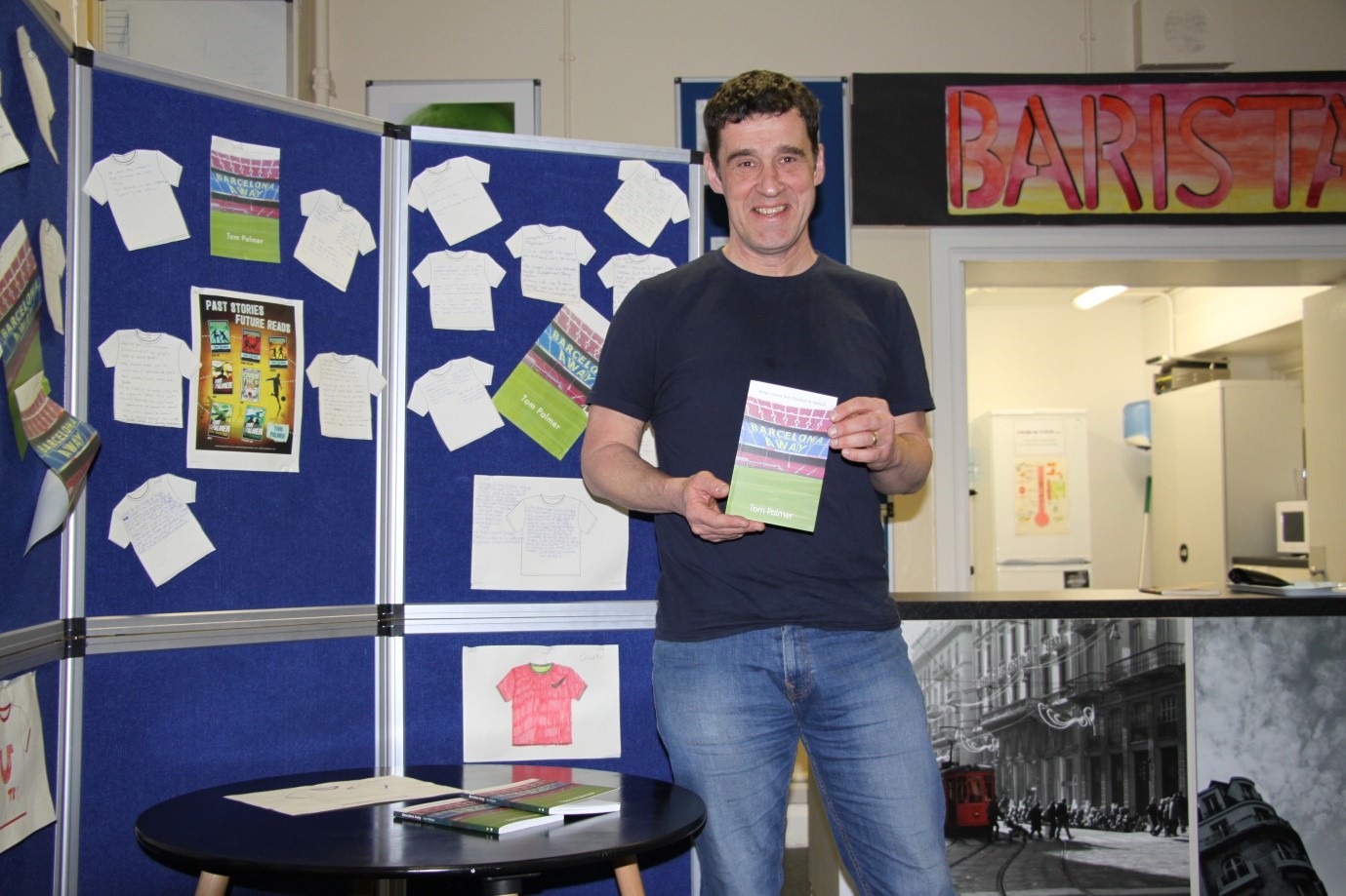 Tom holding book
